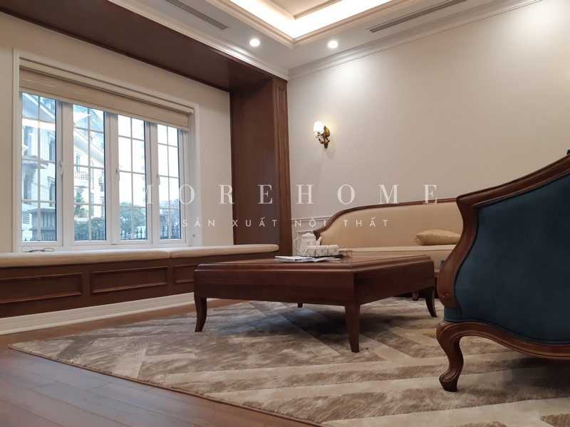 Thi công nội thất phòng khách gỗ óc chó mang phong cách tân cổ điển sang trọng cao cấp tôn lên vẻ đẹp cho không gian và sự tiện nghi cho sử dụng của gia chủ